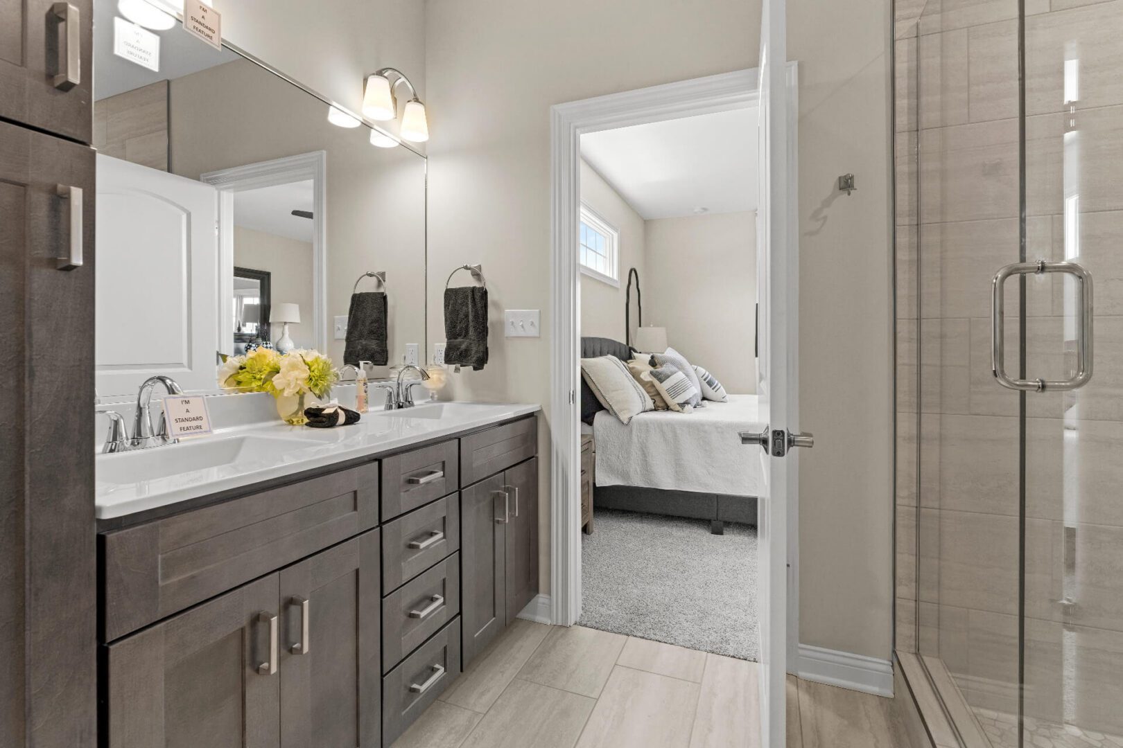 Modern bathroom and bedroom with neutral tones.