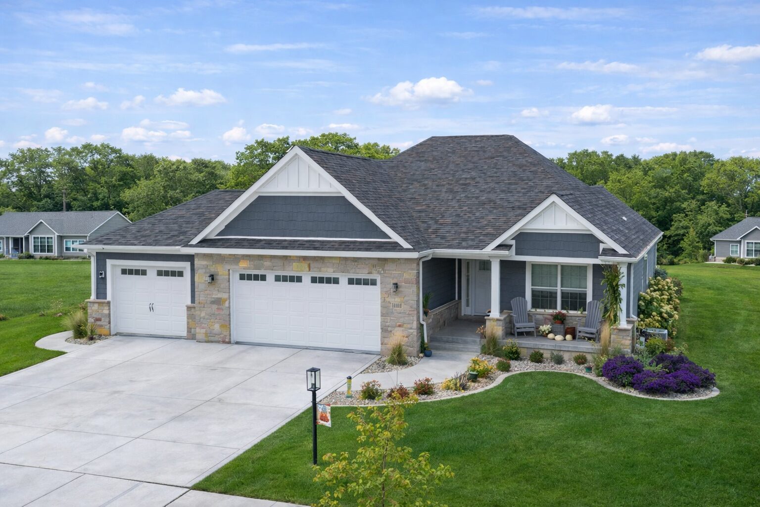 Modern suburban house with spacious driveway.