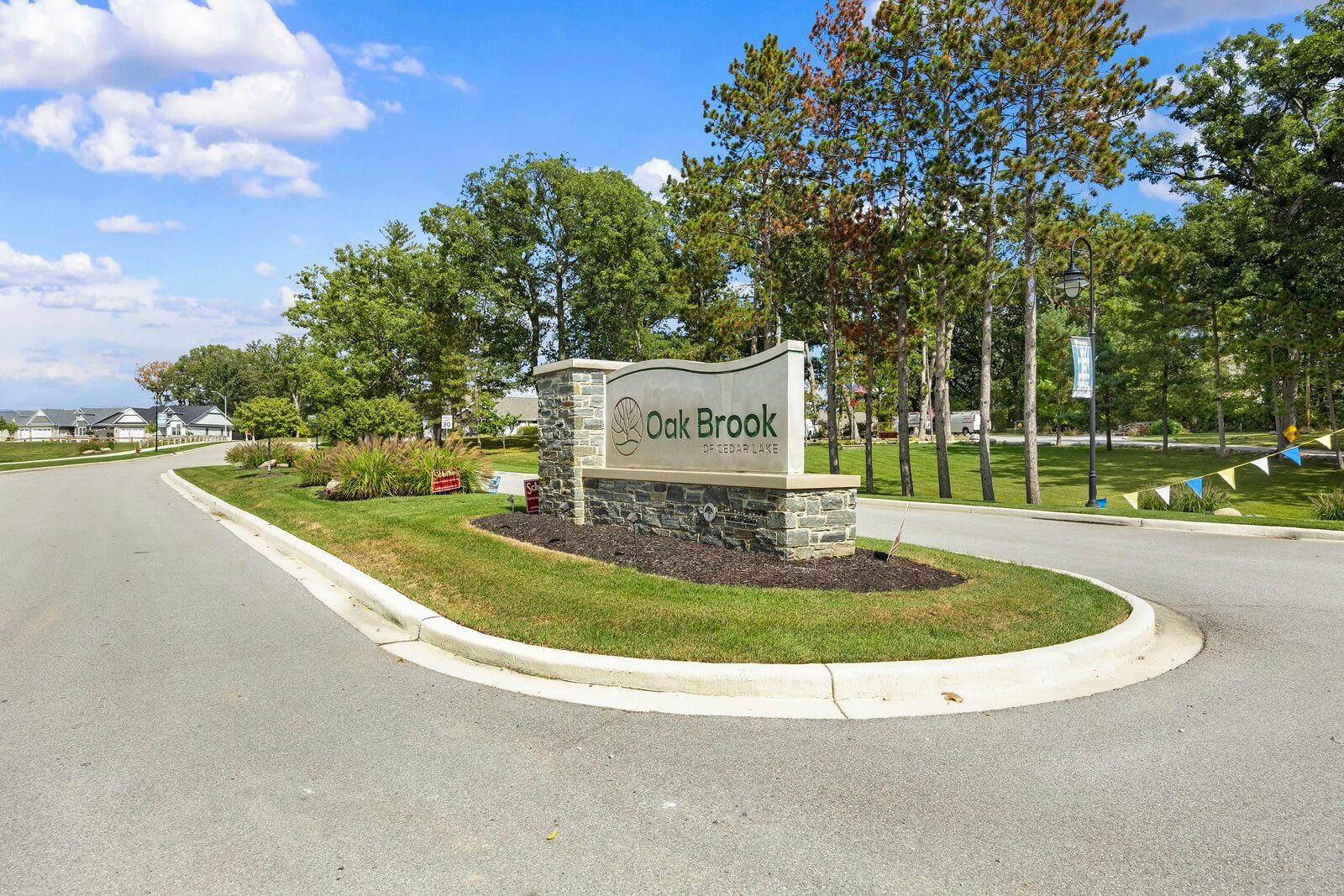 Entrance sign for Oak Brook community.