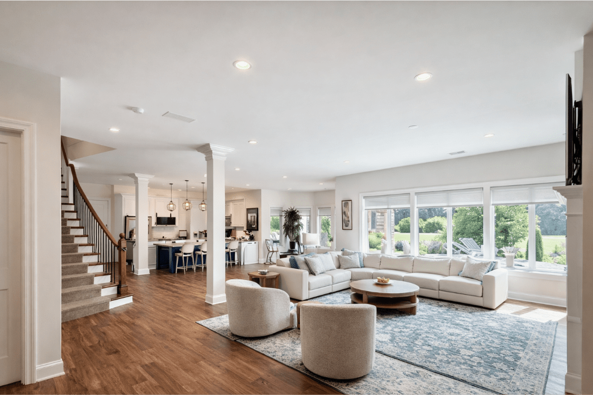 Spacious modern living room with large windows.