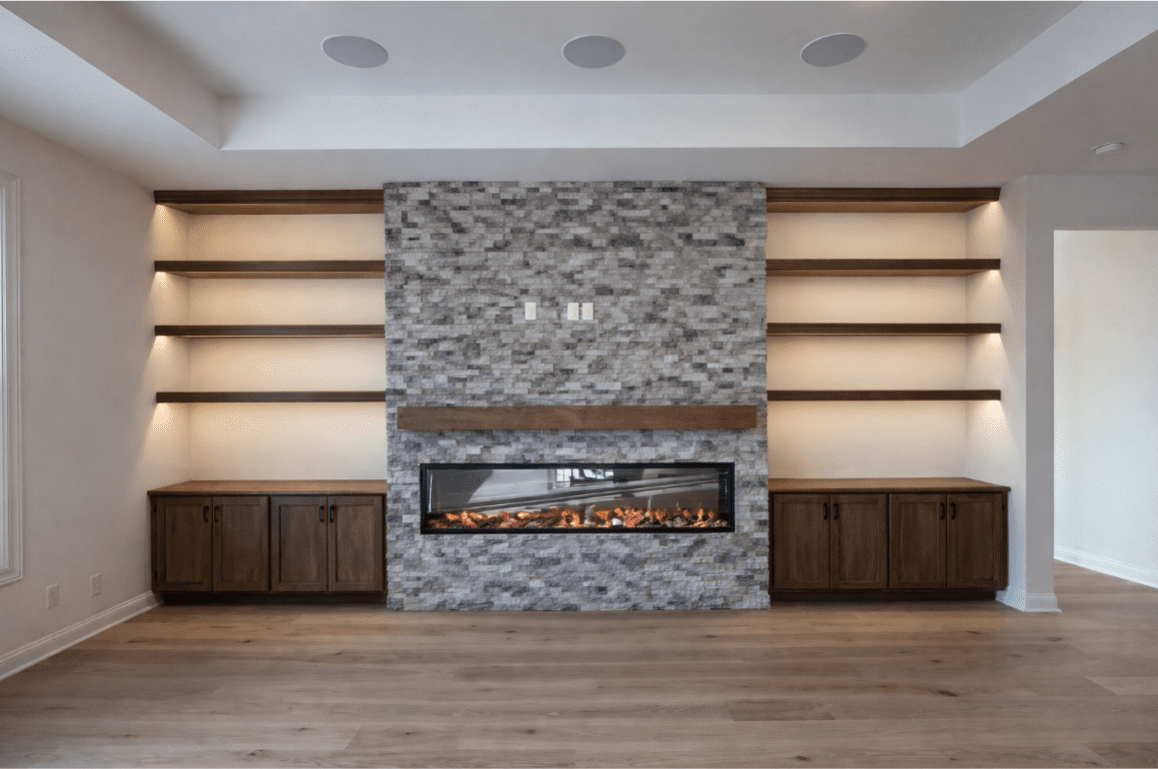 Modern fireplace with stone and wood shelving.